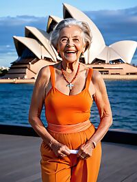 An elderly model poses near the Sydney Opera House in twilight